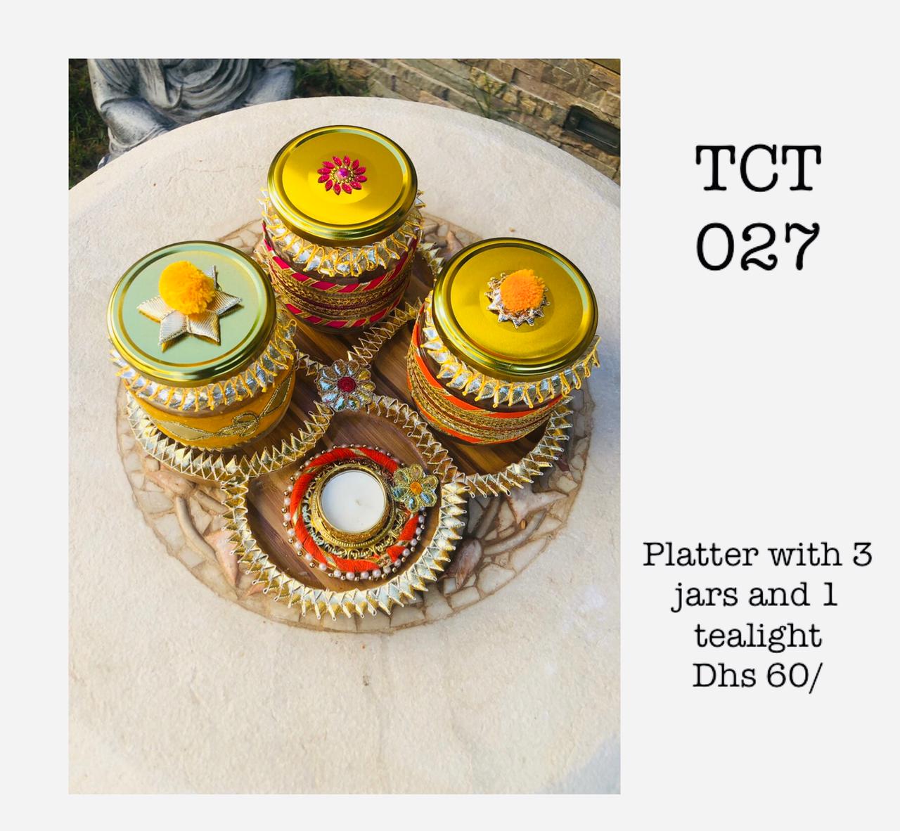 Wooden platter with 3 glass jars and 1 tealight